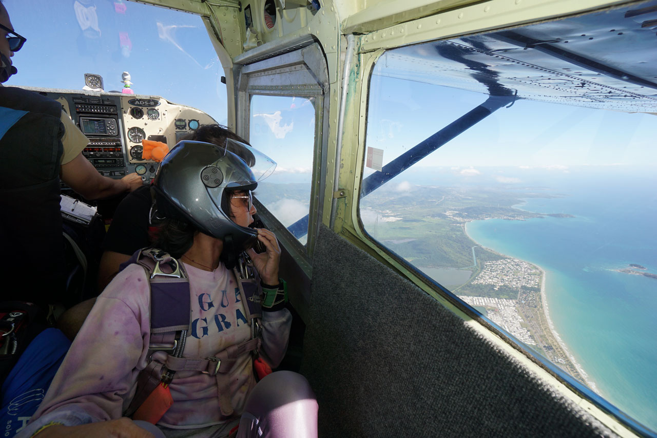 Female skydiver looks out to Puerto Rico’s stunning east coast